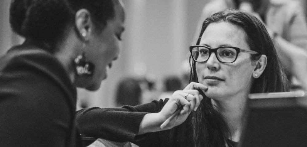 Leading Educator Kelsey McLachlan listens closely to an educator