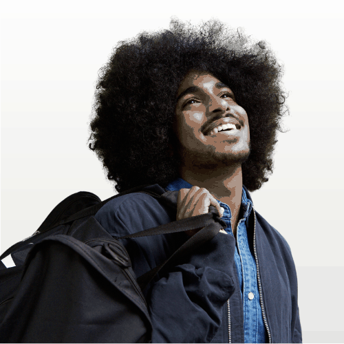 a man smiles holding a backpack