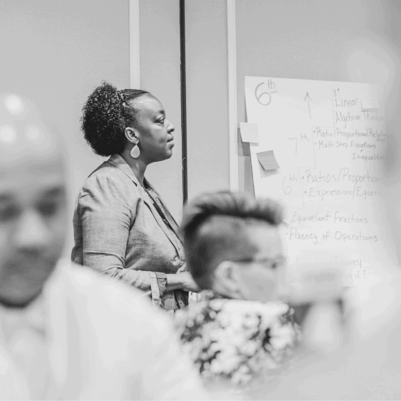 claudine andrews talks in front a group at a professional development