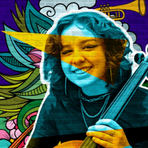 Smiling student playing a musical instrument