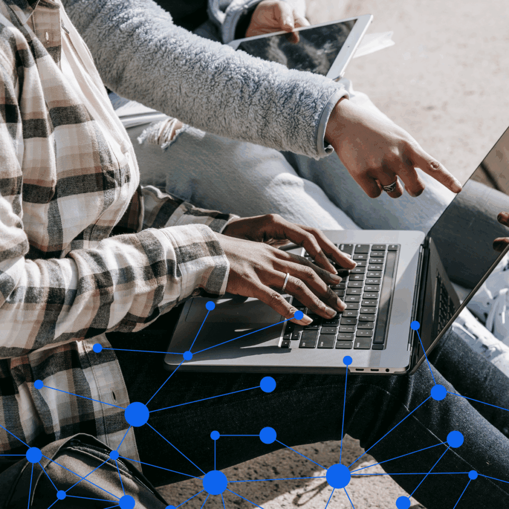 people typing on a computer