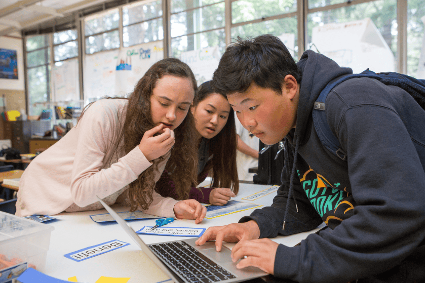 students working on a science project together